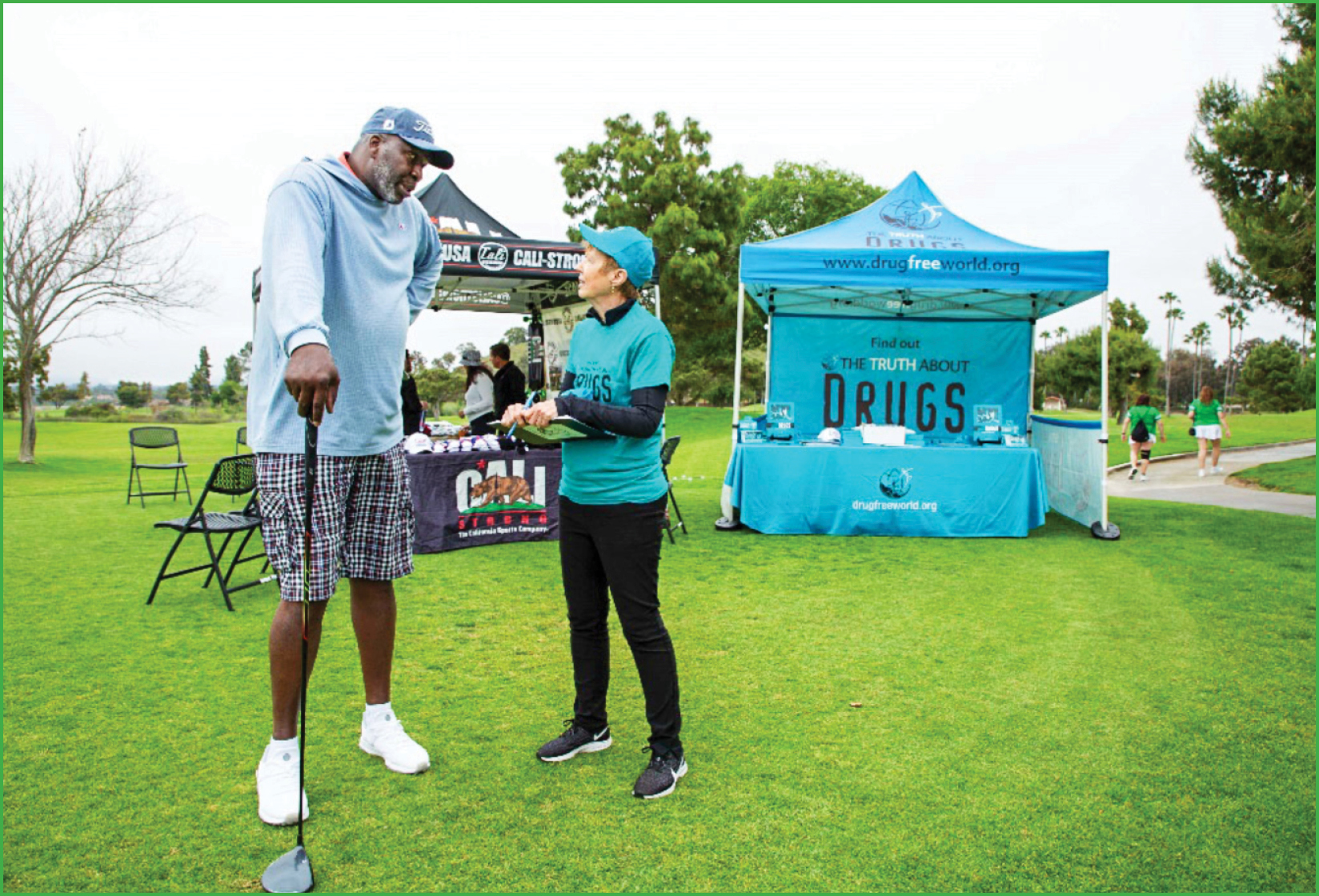 Andre Reed with the Reed Foundation and Drug-Free World swag bag containing Truth About Drugs education materials for annual Celebrity Golf Tournament attendees.